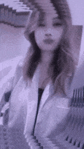 a woman in a white coat is surrounded by a purple background