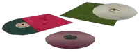 three cd 's are stacked on top of each other and one of them has the letter t on it