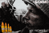 a man in a helmet is holding a gun in front of some bullets that say voi