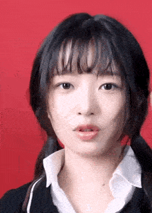 a close up of a woman 's face with her tongue sticking out
