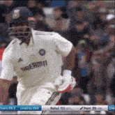 a cricket player wearing a jersey that says ' dream11 ' on it