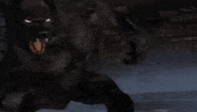 a close up of a werewolf with its mouth open in the dark
