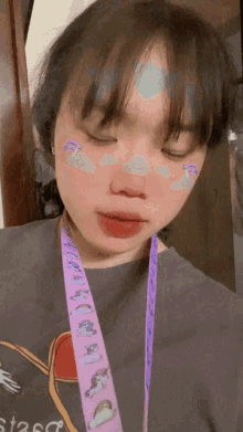 a girl with a purple lanyard around her neck that says ' star ' on it