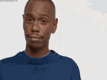 a man in a blue sweater is talking about liking internet porn .