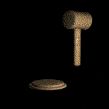 a wooden hammer is hitting a metal object