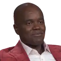 a man wearing a red jacket and white shirt