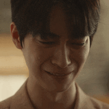 a close up of a man 's face with a tear running down his face