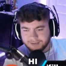 a man wearing headphones is talking into a microphone and the word hi is above him