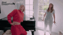 two women standing in front of a piano with the words real housewives out of context
