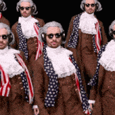 a group of men dressed in patriotic costumes are standing in a line
