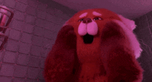 a red panda stuffed animal is making a funny face in a bathroom .