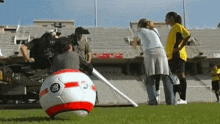 a soccer ball with the number 80 on it is on a field
