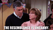 a man and a woman are standing next to each other in a room .