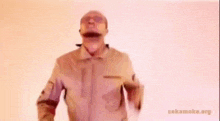 a man in sunglasses is pointing at the camera .