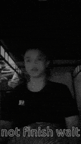 a black and white photo of a person with the words not finish wait