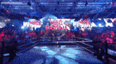 a man in a wrestling ring with mike santana on the screen