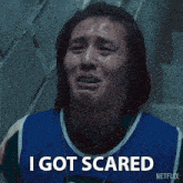 a woman in a blue shirt says i got scared on netflix