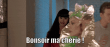 a woman in a green costume says bonsoir ma cherie in front of two other women