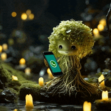 a figurine of a plant holding a cell phone with a green circle on the screen