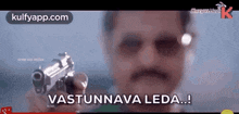 a man holding a gun with the words vastunnava leda written on it