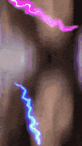 a close up of a person 's torso with a purple lightning bolt on it