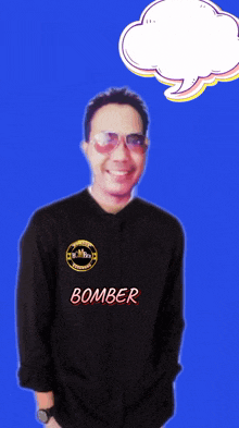 a man wearing a black shirt that says bomber