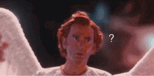 a man with angel wings has a question mark on his face .