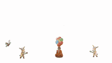 a bunch of statues with balloons and birds