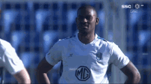 a soccer player wearing a shirt that says mc
