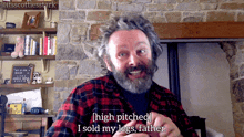 a man in a plaid shirt is talking about his legs