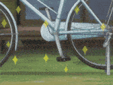 a close up of a bicycle with a yellow diamond on it