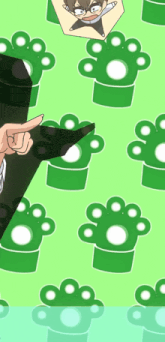 a green background with paw prints and a person pointing at them