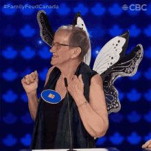 a woman wearing a butterfly costume has a name tag that says mo