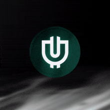 a green coin with a white letter u inside of it