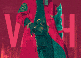 a man in a red coat with a patch that says jesus on it