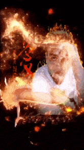 a man in a white shirt is surrounded by flames and the word fire is on the bottom
