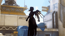 a woman with wings is standing in front of a building that says wp-c