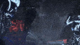 a man in a suit and tie is standing in front of a group of red monsters
