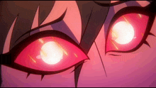 a close up of a person 's eyes with glowing red circles