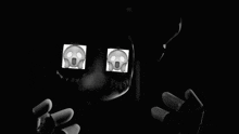 a black and white photo of a cartoon character with a screaming face on his eyes .