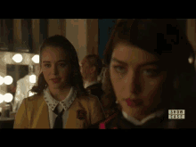 two girls are standing next to each other in front of a mirror with the words show cases on the bottom
