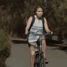 Biking Elizabeth Holmes GIF - Biking Elizabeth Holmes Amanda Seyfried GIFs