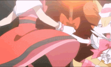 a girl in a pink dress is holding the hand of another girl in a white dress