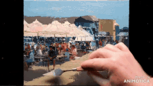 a person is painting a scene with the words made in animotica on the bottom right