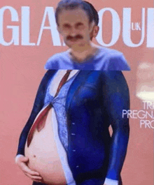 a man in a suit and tie is holding his pregnant belly .