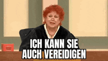 a judge with red hair is sitting at a desk in a courtroom and says `` ich kann sie auch verteidigen '' .
