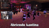 a group of people dancing in a room with the words abriendo kantina