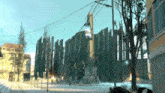a computer generated image of a city with a few buildings and a tree