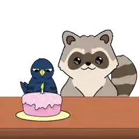 a bird and a raccoon sitting next to a birthday cake