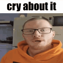 a man wearing glasses and an orange hoodie has the words cry about it above him